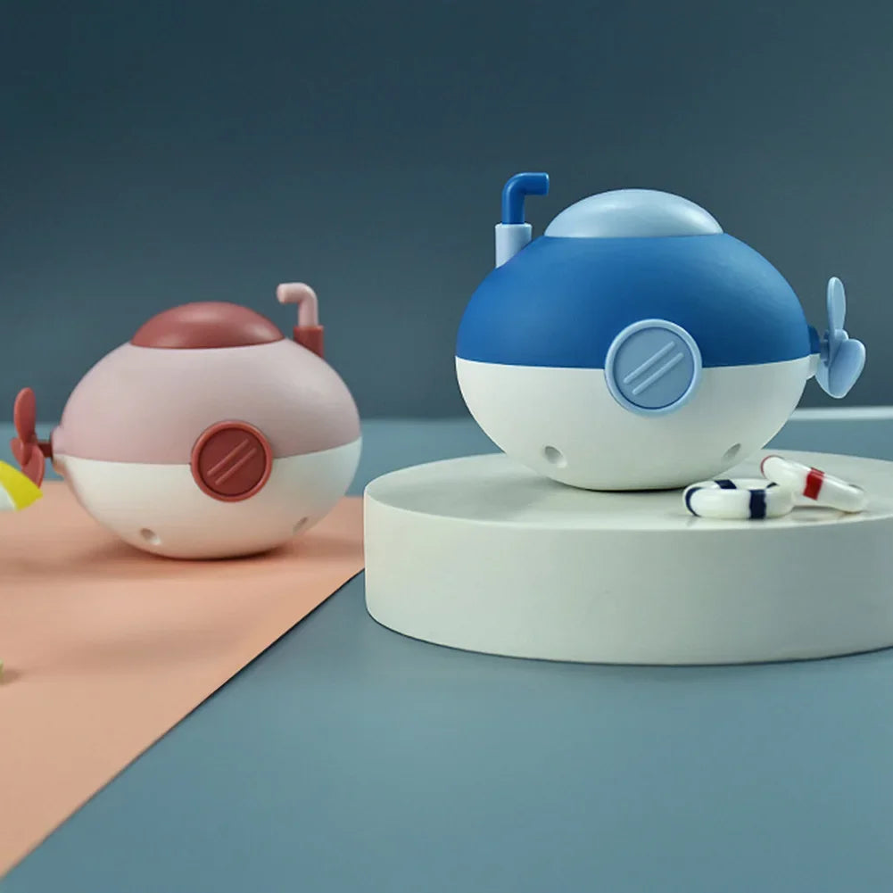 Baby takes a bath and plays in the water, Submarine, winding up animal chain, playing in the bathroom, children's toys